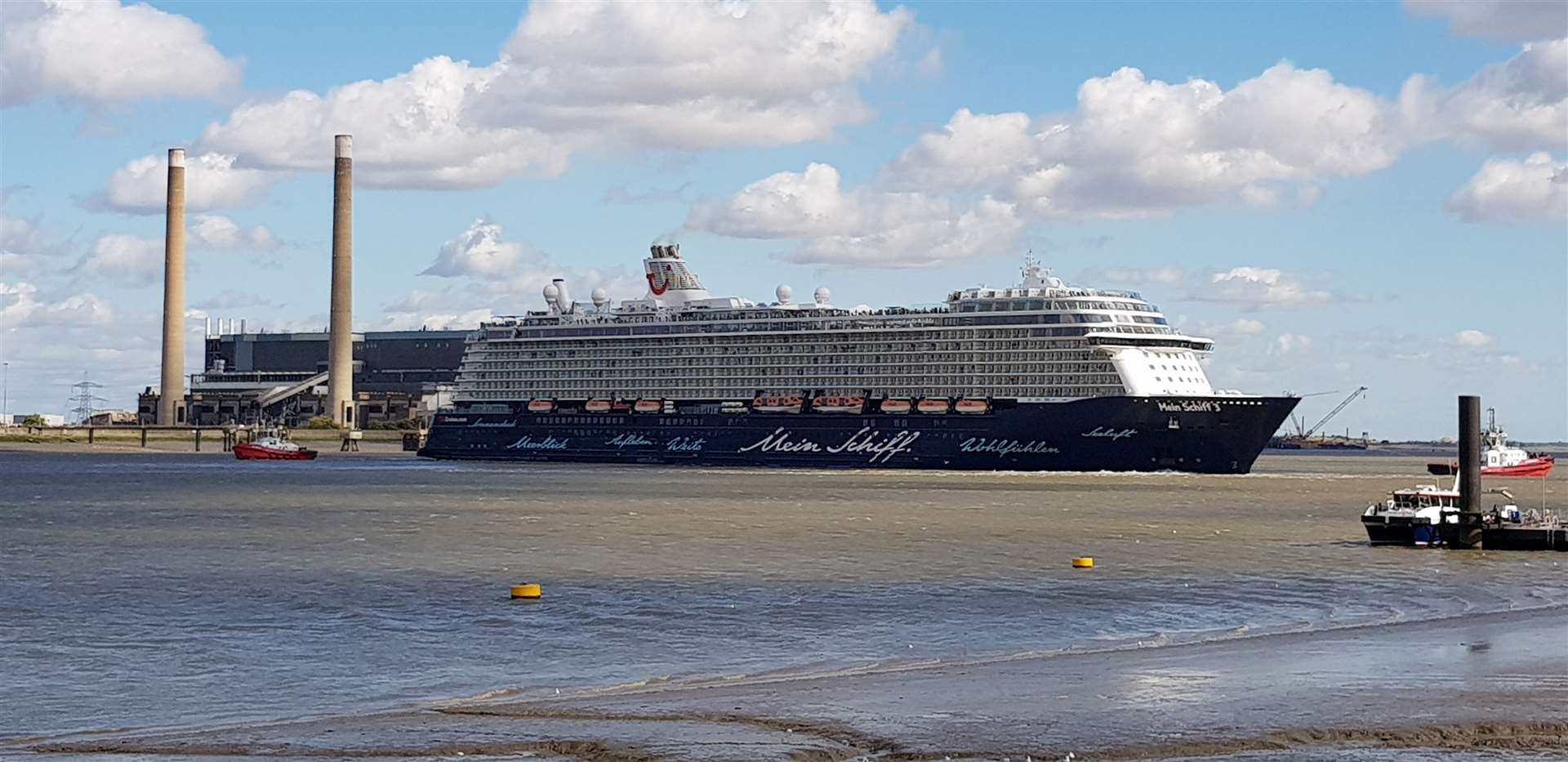 Cruise ship TUI Mein Schiff 3 prepares to head out to sea after being delayed by high winds.