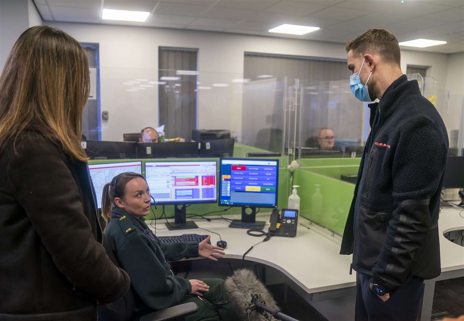 England star and Liverpool captain Jordan Henderson chats to a 999 call hander (Danny Lawson/PA)