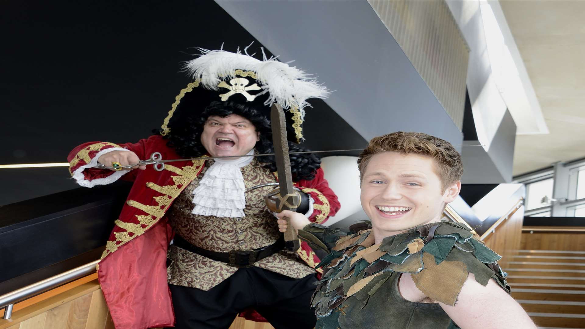 Shaun Williamson as Captain Hook crosses swords with Milkshake's David Ribi as Peter Pan Picture: Paul Amos
