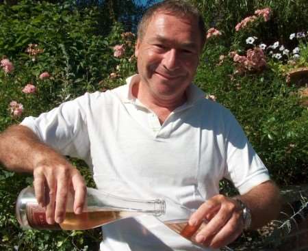 Richard Balfour-Lynn samples a bottle of his award-winning Balfour Brut rose wine