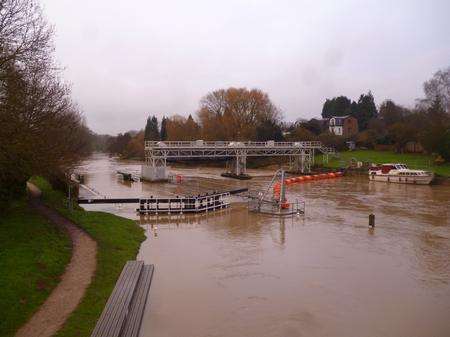 The lock at East Farleigh almost disappears under the high river.