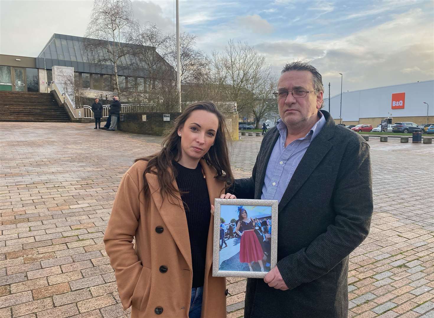 The family of Gemma Robinson with a photo of her outside Maidstone Crown Court
