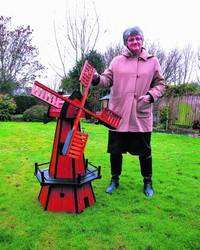 Jane Stevens with the windmill which had been stolen from her garden
