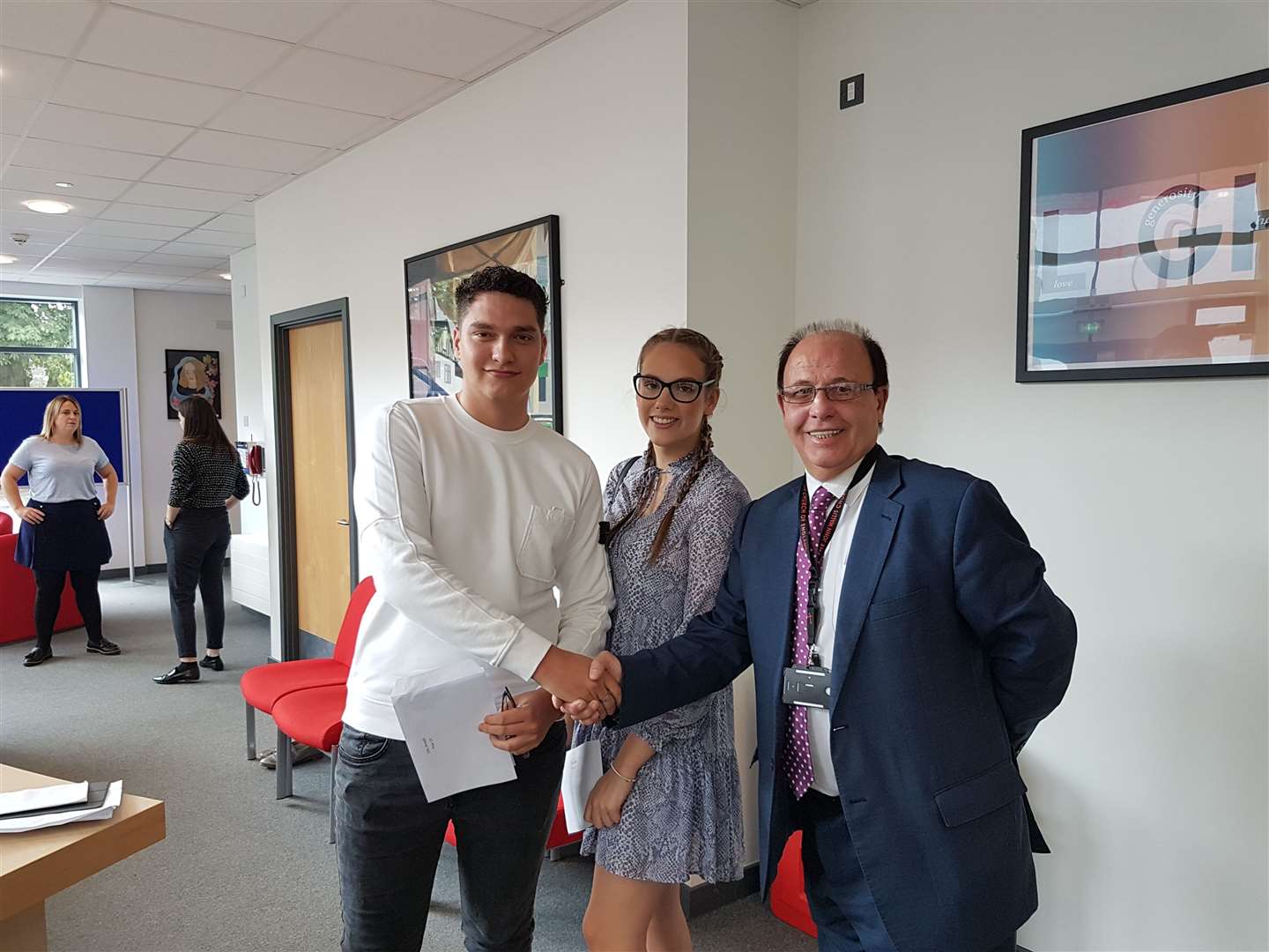 Twins Joe and Millie Lee were congratulated by The John Wallis Church of England Academy's principal, John McParland, after receiving great A-level results (15281540)
