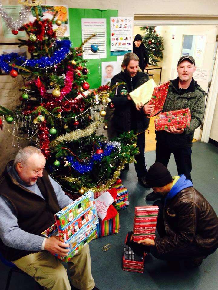 Clients at the Catching Lives homeless shelter in Canterbury receiving shoe boxes donated by Mercury readers