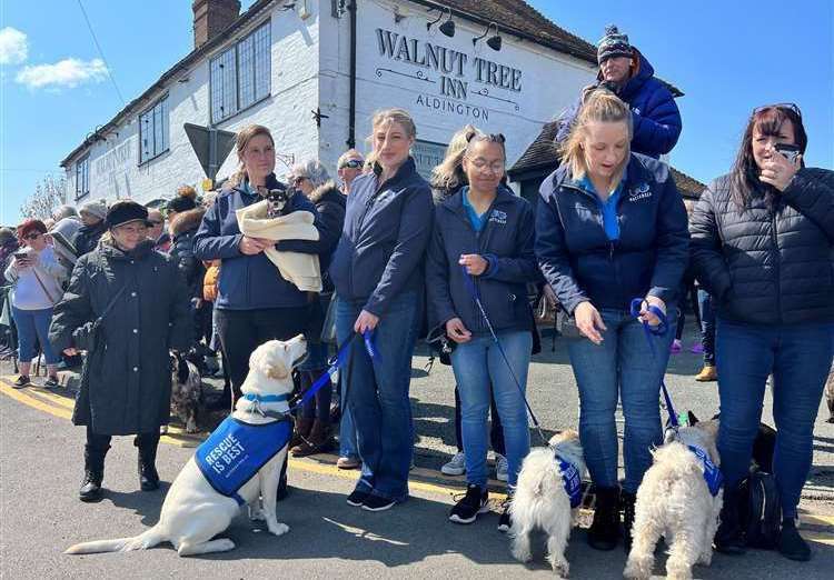 Members of Battersea Dogs and Cats Home at Paul O'Grady's funeral procession in Aldington, near Ashford