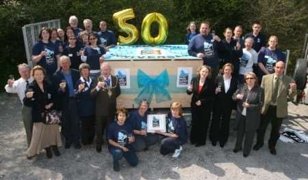 The Kent Wildlife Trust celebrates finishing off the 1.29 tonne seed cake