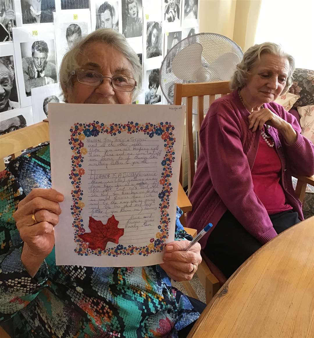 Margaret with her letter at Rogers House Residential Care Home in Wigmore