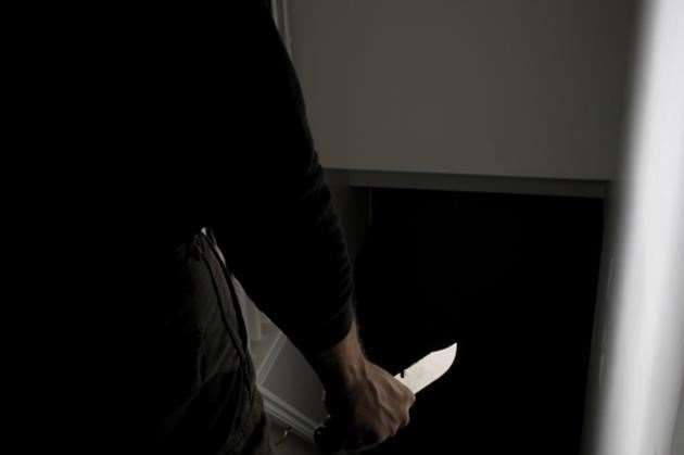 Police seized a knife with traces of blood on the blade. Stock image