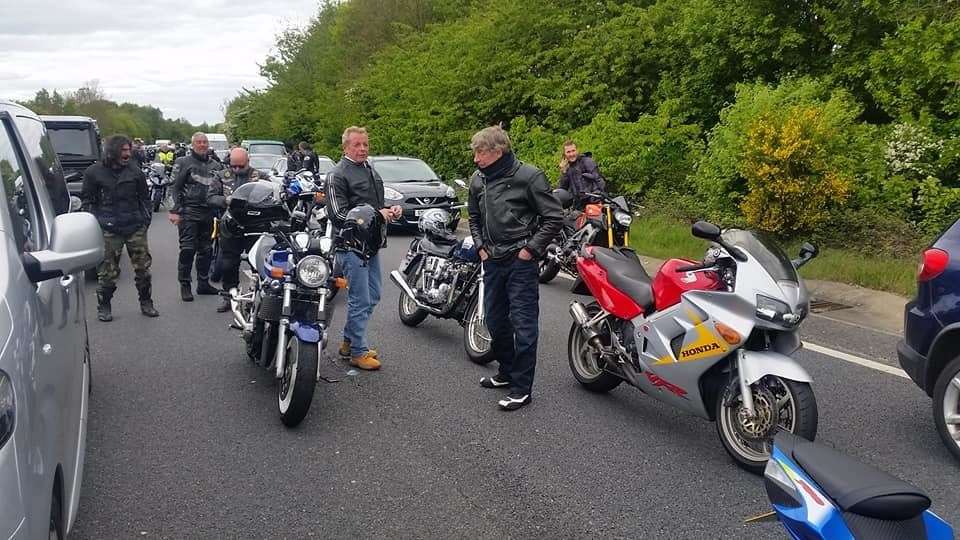 Bikers stretch their legs while waiting for the A21Tonbridge Bypass to reopen. Picture: Keith Roberts (9740213)