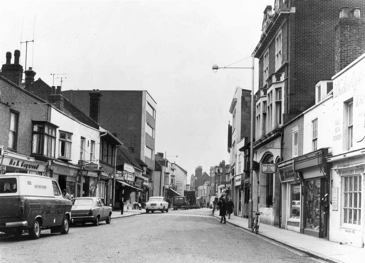 Whitstable high street in 1982. Wheeler's Oyster Bar, on the right, is still there today