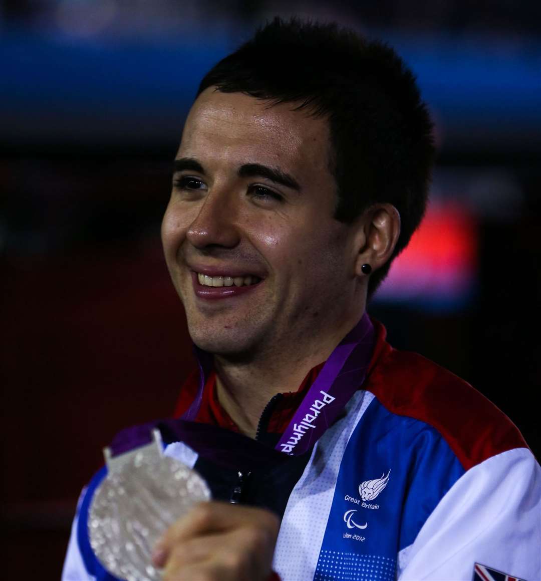 Will Bayley celebrates with his silver medal from the men's single's class 7 gold medal match at the Excel Arena. Picture: John Walton/PA