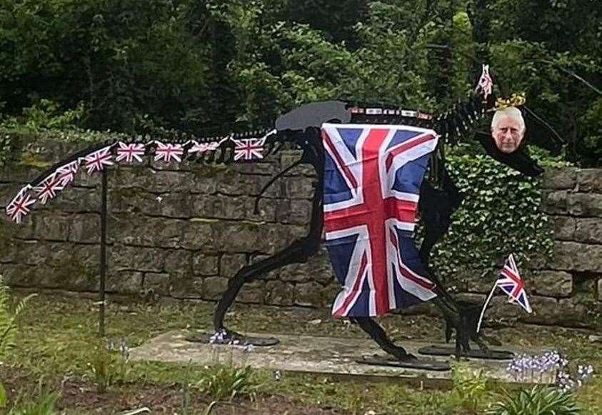 Iggy the Iguanodon in Bearsted, Maidstone dressed ready for the coronation. Picture: Hannah Danielle