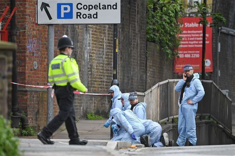 Police forensic officers in Peckham (Kirsty O’Connor/PA)