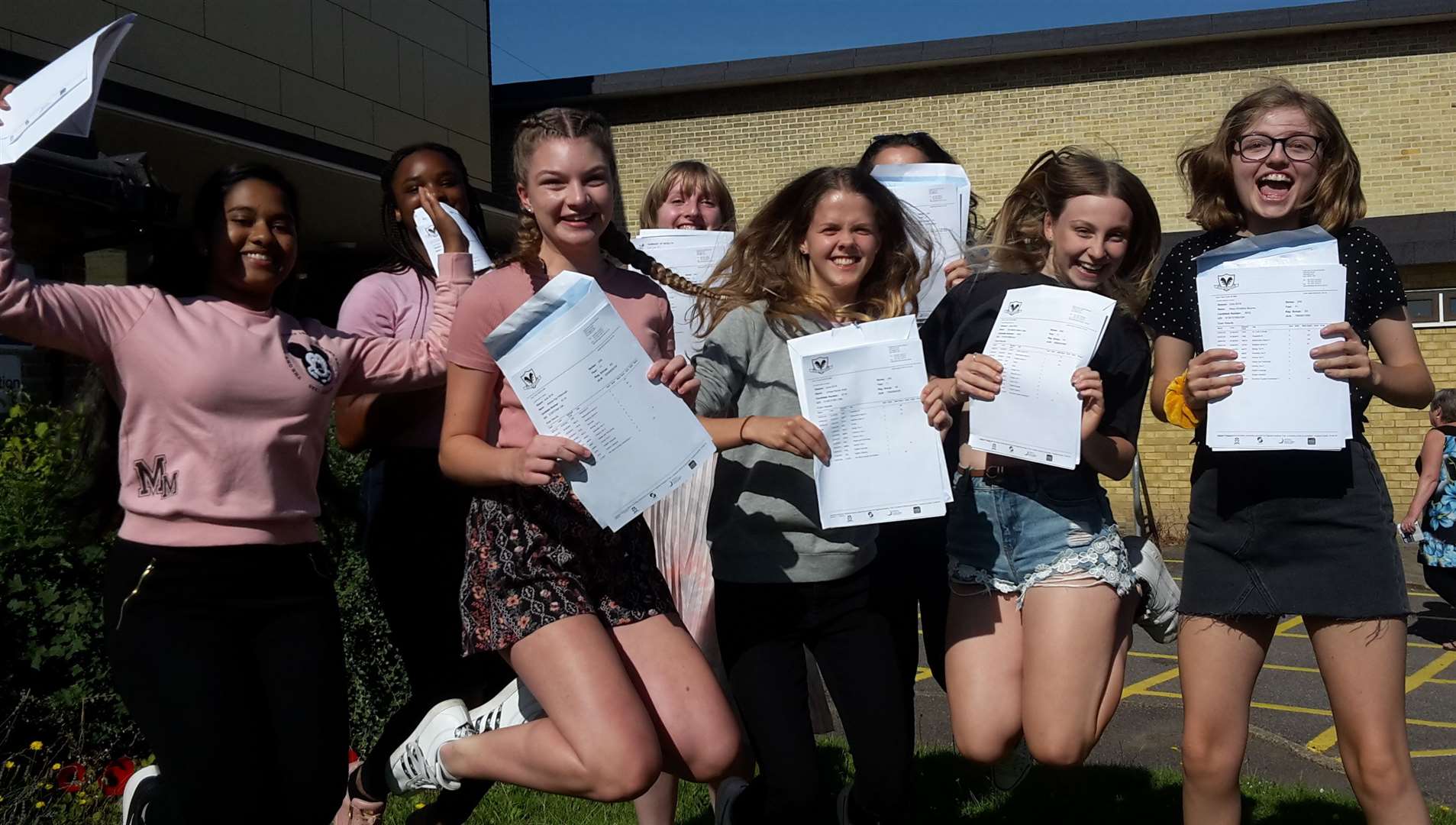 Girls at Highsted Grammar School jump for joy with their results