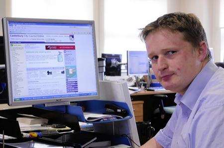 Reporter Adam Williams looking at the theatre website
