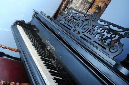 A grand piano that was found worth thousands of pounds at a house full of rubbish.