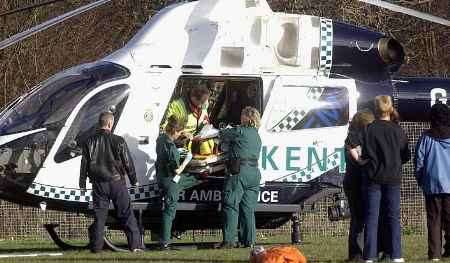 The boy is placed into the air ambulance. Picture: GRANT FALVEY