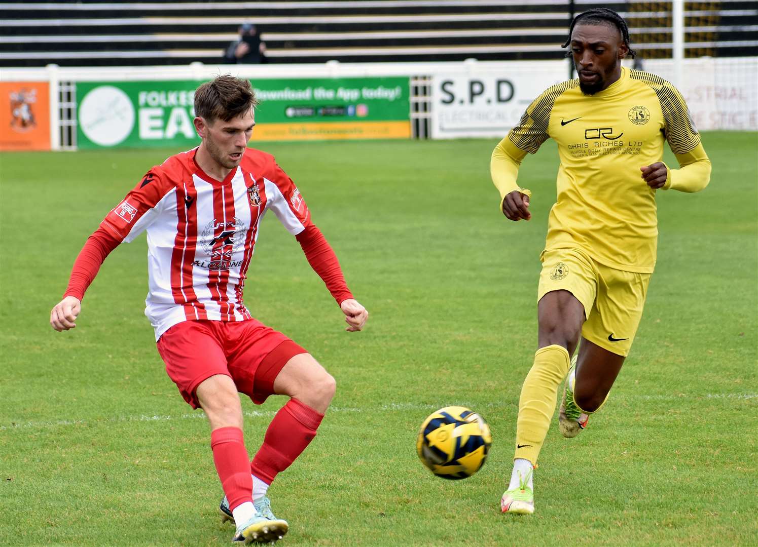 Folkestone's Kane Penn in possession against Herne Bay as winger Gil Carvalho closes in amid their weekend 1-1 friendly draw pre-season friendly. Picture: Randolph File