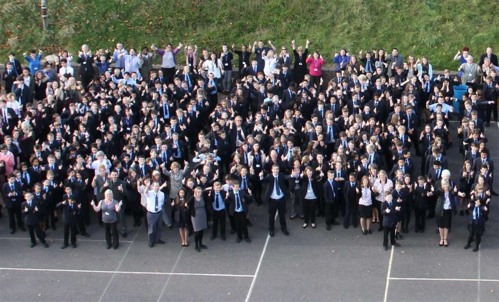 Thumbs up - pupils at St Edmund's happy that the school has been taken out of special measures