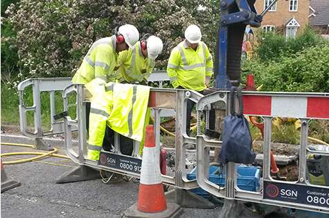 Engineers remove water from the gas main in Church Lane. Picture: SGN