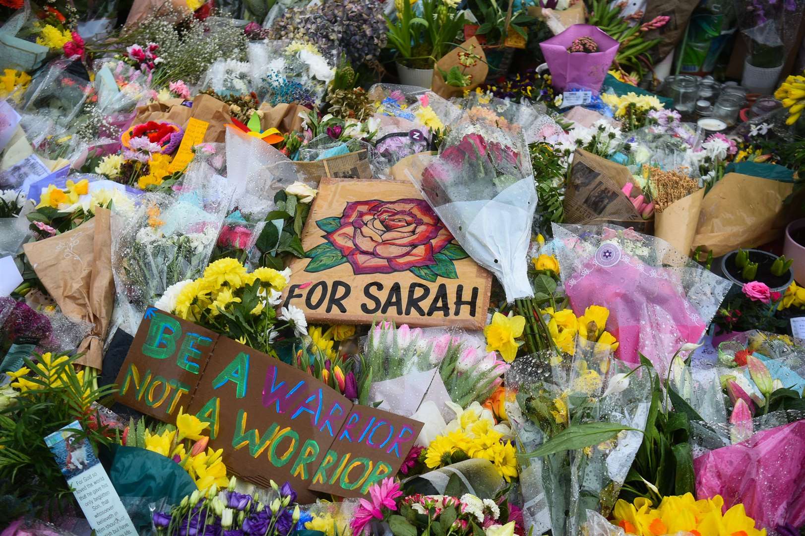Floral tributes left next to the bandstand in Clapham Common, London, for Sarah Everard (Kirsty O’Connor/PA)