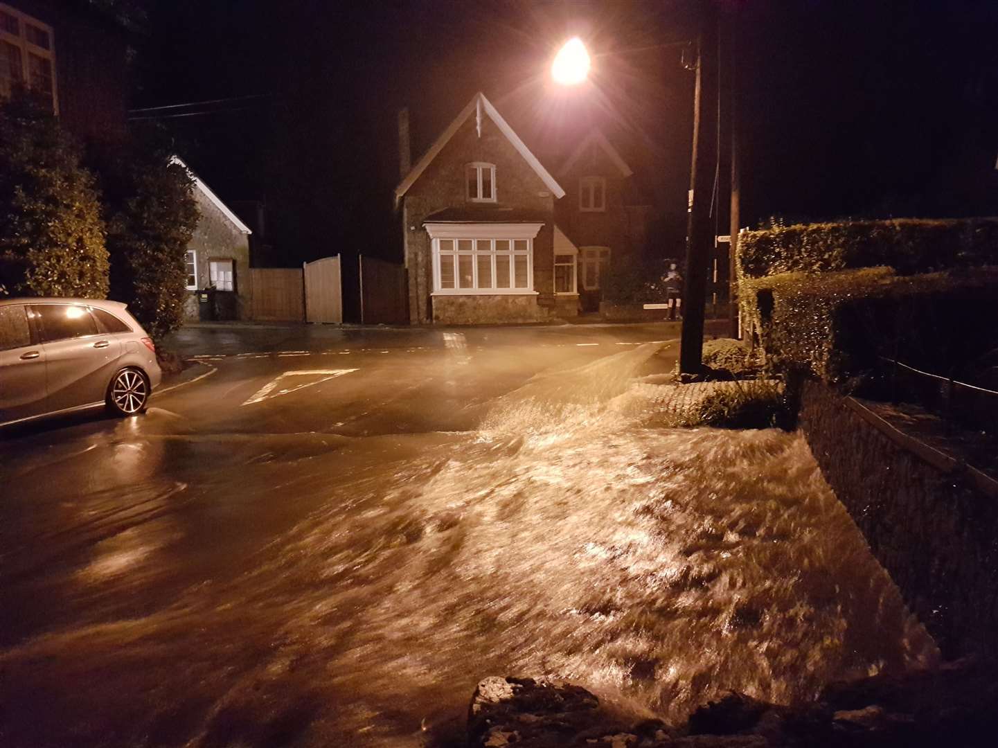 Bull Road in Birling was submerged by flood water on Tuesday night. Top - Tracey Diss' wooden gates were thrown open by flood water. Picture: Richard Harrison-Murray (12156654)
