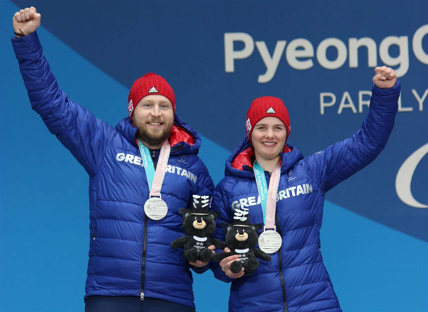 Millie Knight and her guide Brett Wild celebrate winning silver at the Wintger Paralympics in PyeonChang