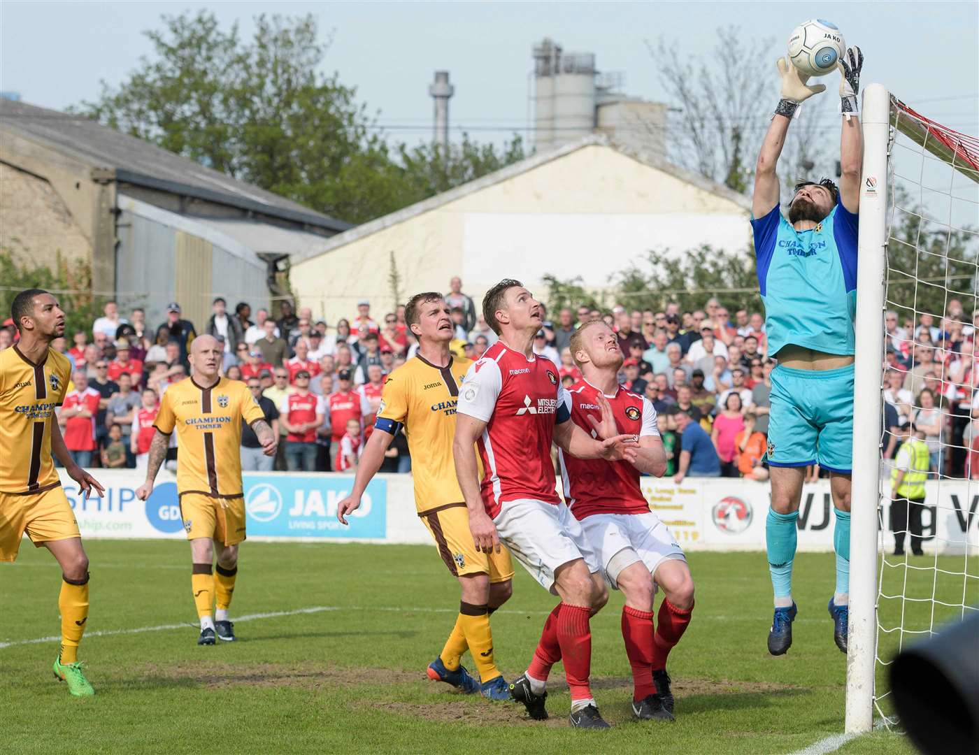 Dave Winfield and Kenny Clark watch Sutton keeper Jamie Butler claim this cross Picture: Andy Payton