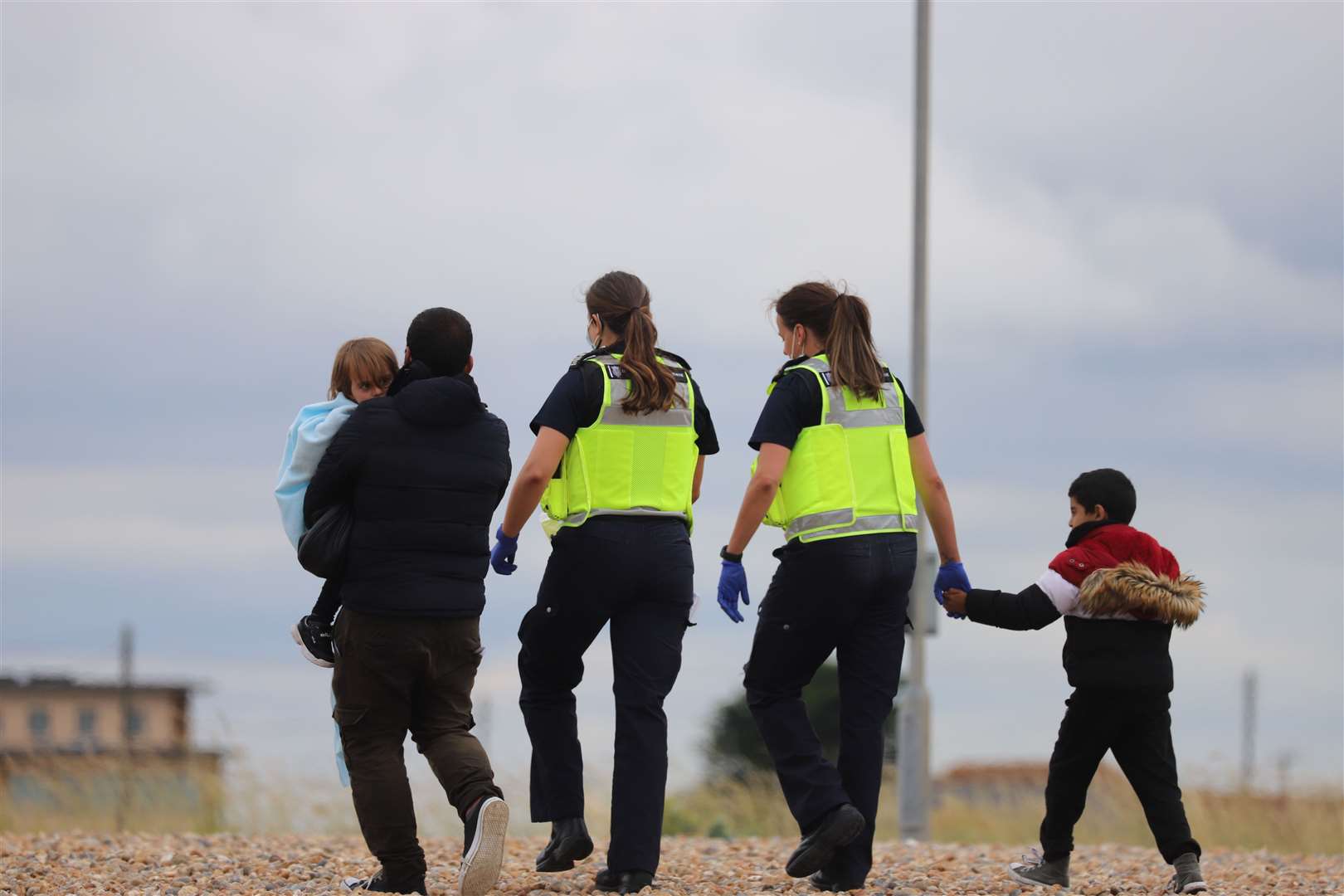 Photo shows asylum seekers landing on the beach in Kent