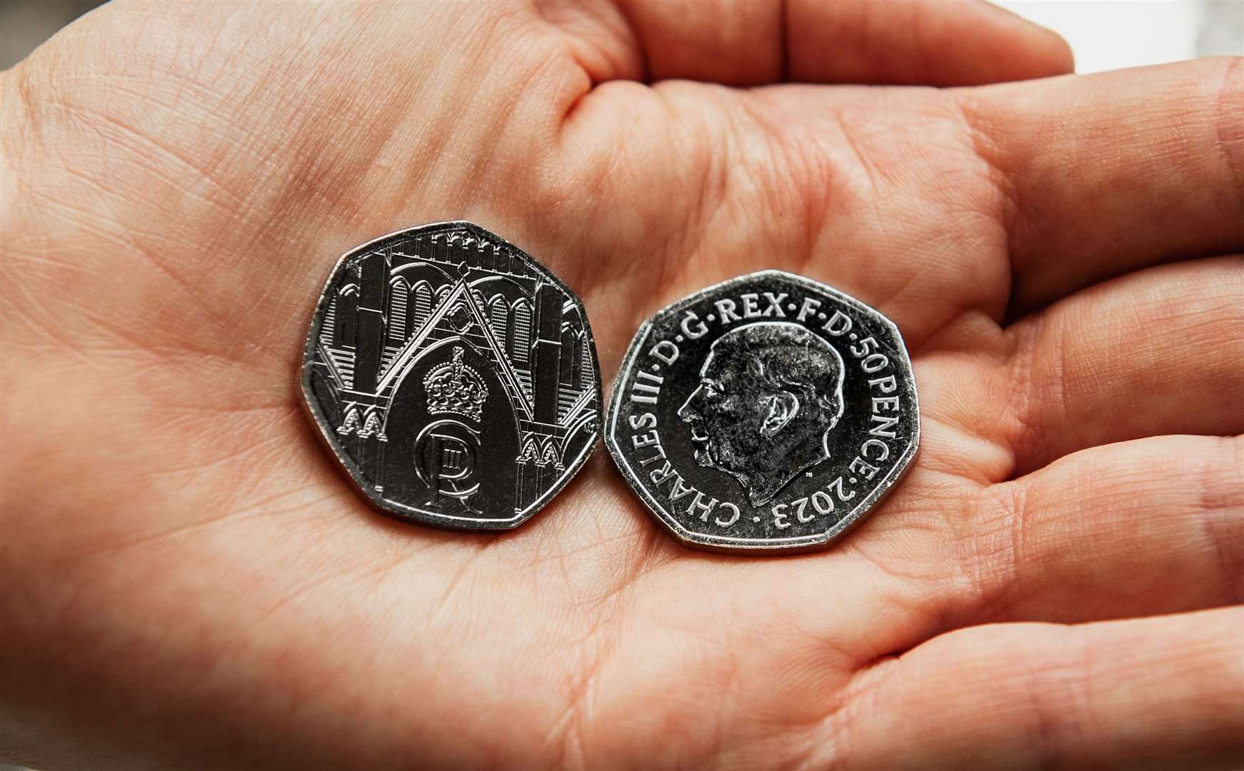 The coin features Westminster Abbey and the King’s cipher on the back. Image: The Royal Mint.
