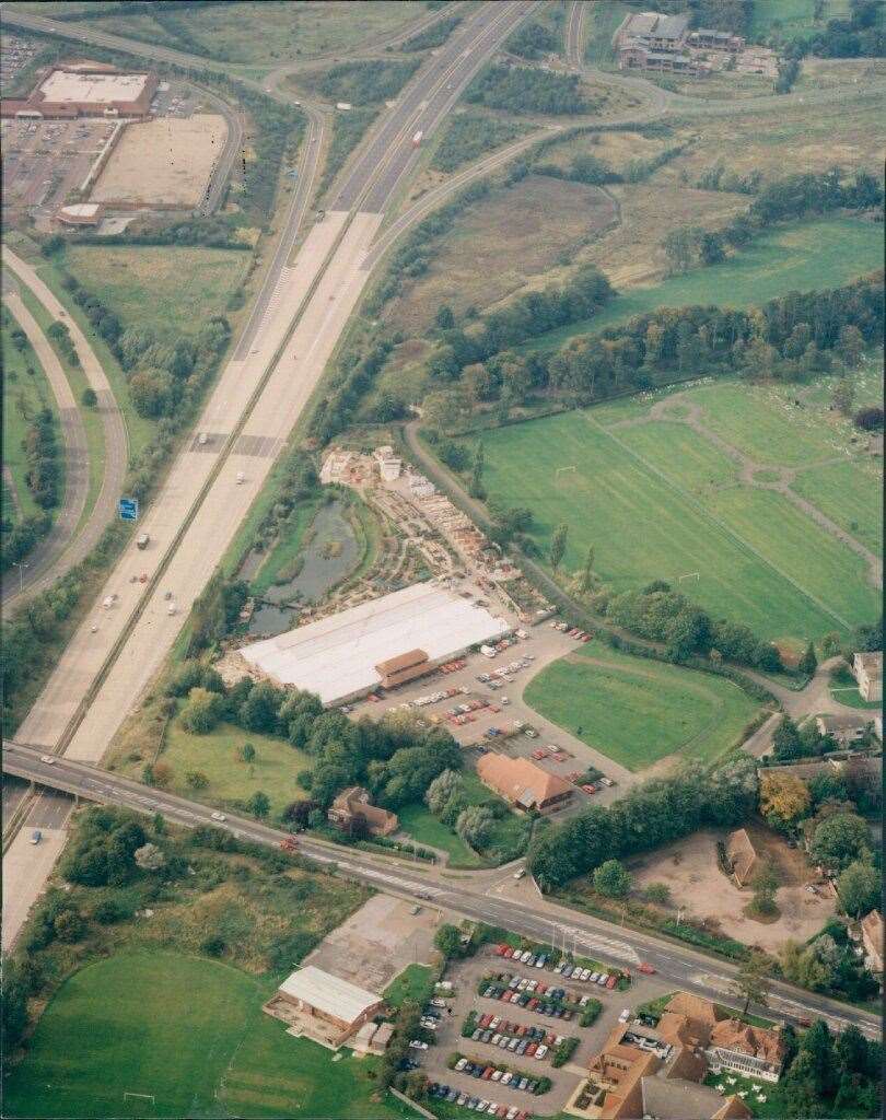Ashford pictured in 1990, Bybrook Barn garden centre is in the centre of the frame, with the M20 and Canterbury Road. In the bottom left is the former Houchins sports and social club. Pic: Steve Salter