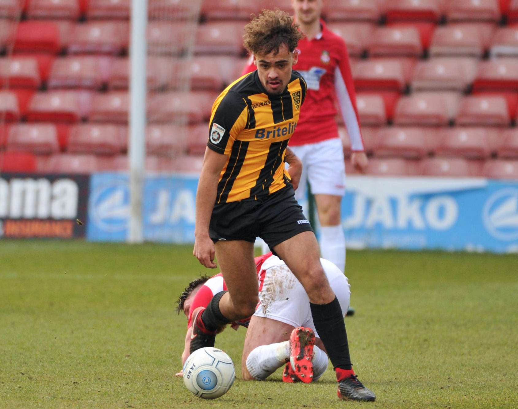 Michael Phillips leaves a Wrexham player on the floor (1285811)