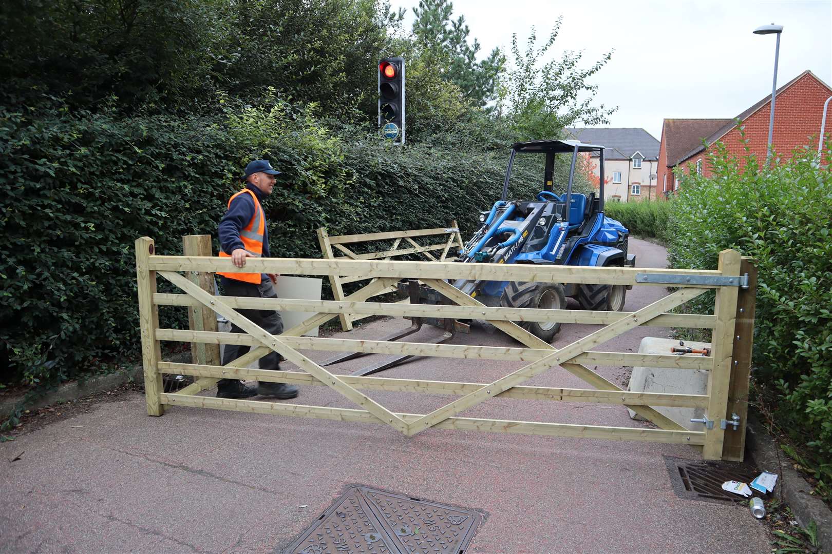 One of the two new gates being fitted at either end of the bus lane at Murston