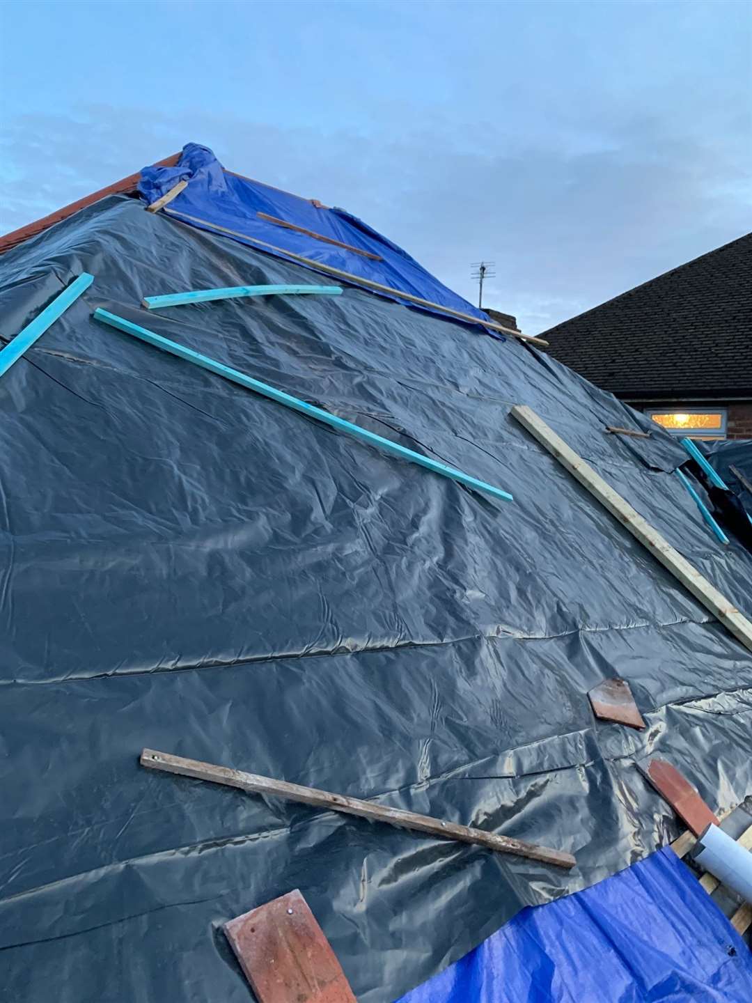 Makeshift sheeting covers up damage at the property in River Drive, Strood (28014057)