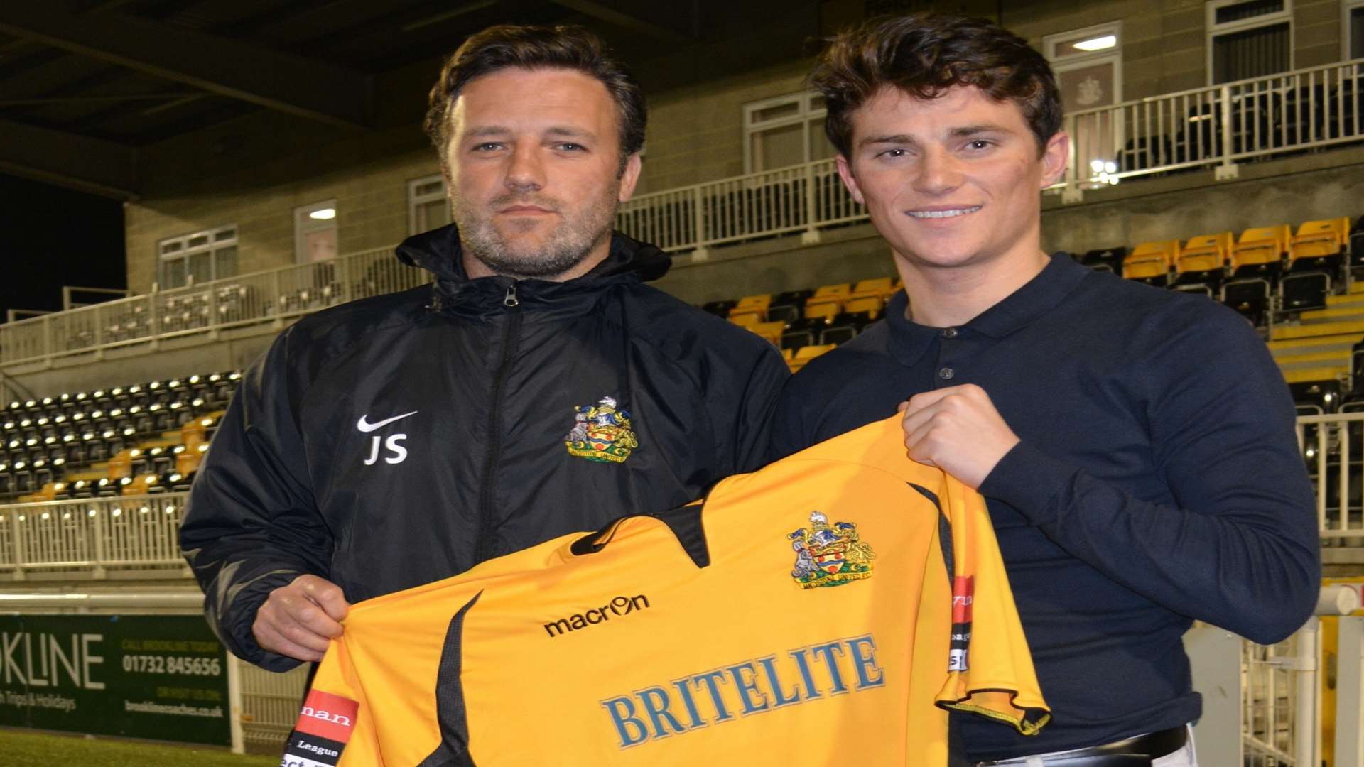 Maidstone boss Jay Saunders welcomes new signing Jack Paxman to the Gallagher Stadium