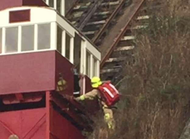 The first firefighter accessed the lift from the side sliding doors and managed to climb inside