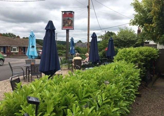In front of the hedge, there are a further half a dozen tables and chairs where you can enjoy you lunch or simply sup on a pint while you watch the world go by