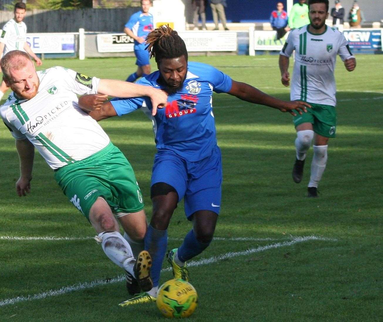 Former Herne Bay midfielder Bola Dawodu, pictured against Guernsey in 2019, will face his former club with Bowers & Pitsea this Saturday