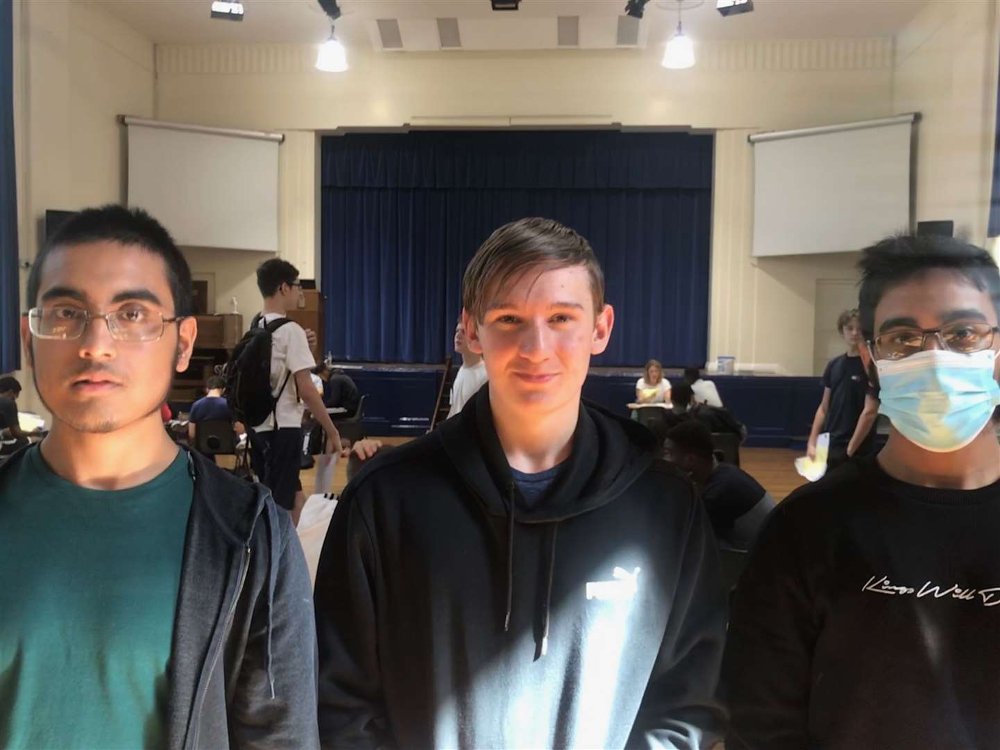 Joshua Harris (centre) with twins Ashraf (left) and Armaan Uddin, of Lennox Road, Gravesend, got all 9s