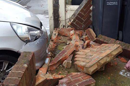 A car demolished part of a garden wall. Picture: Kent 999s