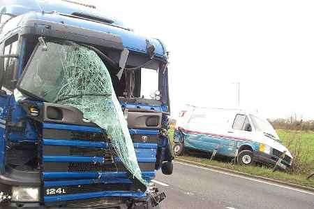 BADLY DAMAGED: the lorry and the van