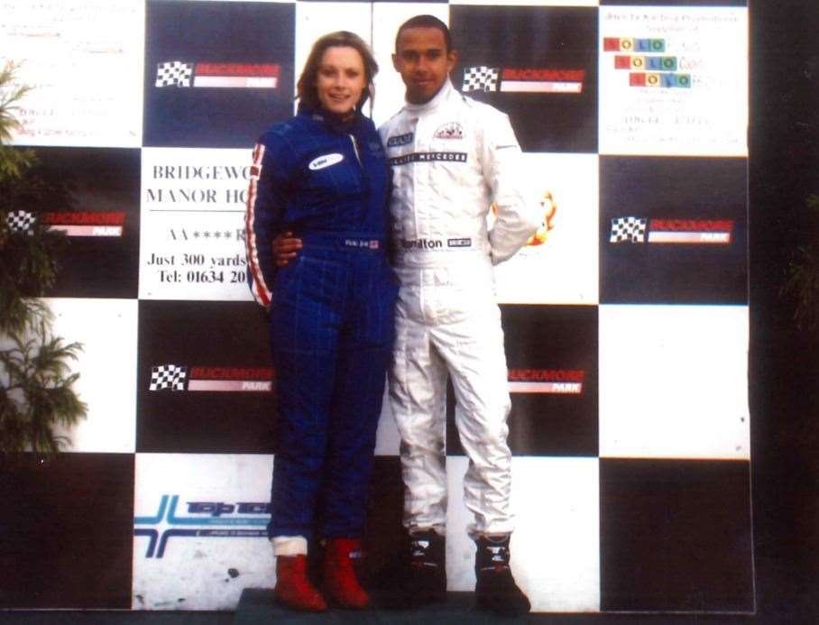 Television presenter Vicki Butler-Henderson with Lewis Hamilton on the Buckmore podium
