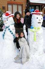From left Shanice Eaton, 12, Sharna Eaton, 8, and Klein Cole, 11, made some excellent snowmen in Delamark Road, Sheerness