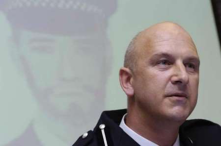 ACC Adrian Leppard at a press conference with an e-fit of one of the robbers in the background. Picture: GRANT FALVEY