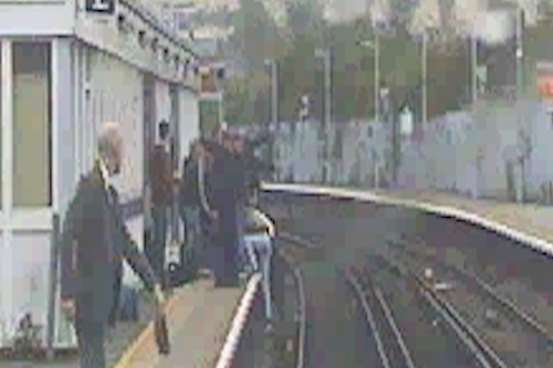 The woman is dragged onto the platform at Strood with seconds to spare. Picture: Southeastern