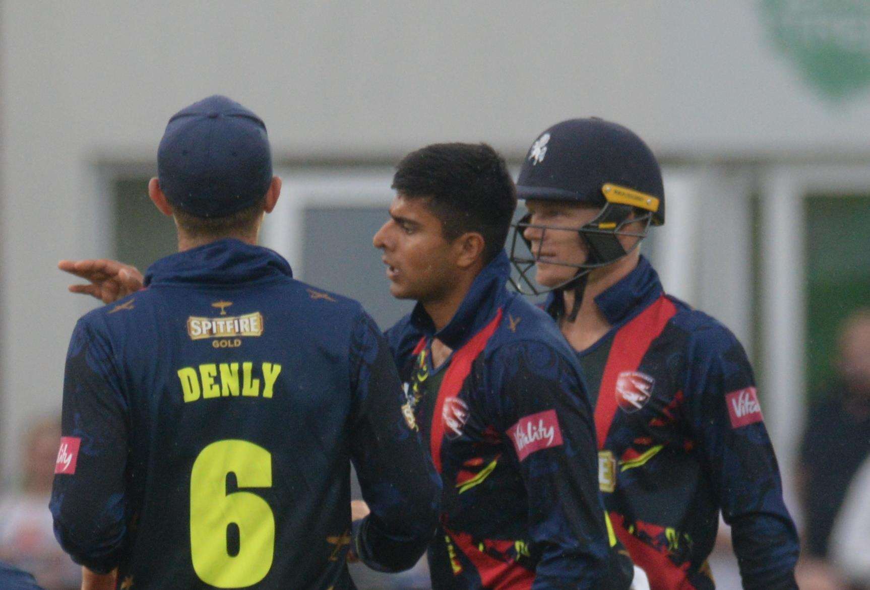Kent players congratulate Imran Qayyum after he bowled Surrey's Aaron Finch. Picture: Chris Davey