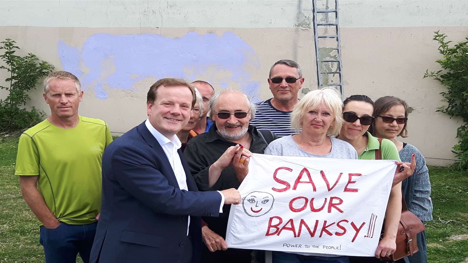 Charlie Elphicke launches his Save our Banksy campaign at the site of the artwork on the corner of Townwall Street and York Street, Dover