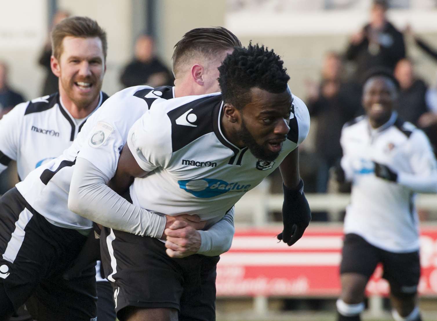 Duane Ofori-Acheampong celebrates after scoring the opening goal against Poole Pic: Andy Payton