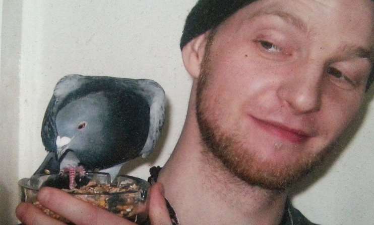 Mark with Sebastian - the pigeon he had hand reared for three years.